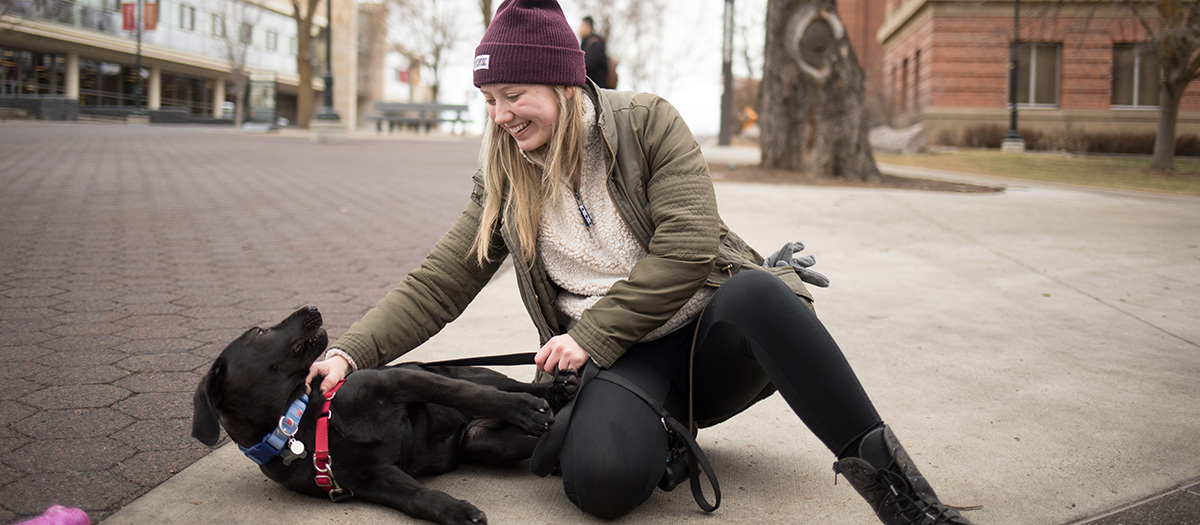 student with dog