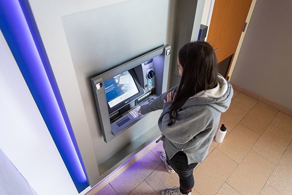 student uses ATM in CUB